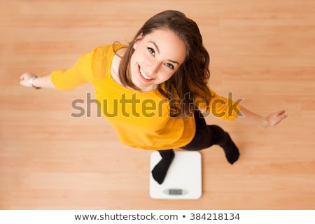 ストックフォト: ��かりの上に立っている幸せな少女