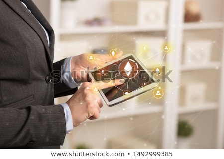 [[stock_photo]]: Business Woman Using Tablet With Bitcoin Link Network And Online