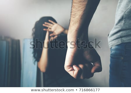 Stok fotoğraf: Woman Beating Up His Husband Illustrating Domestic Violence