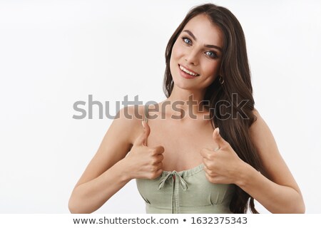 Stock photo: Positive Brunette Female Makes Approval Gesture Keeps Thumbs Raised Being In Good Mood Rejoices S