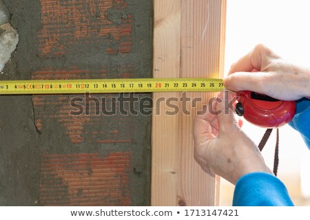 Сток-фото: Bricklayer Taking Measurements