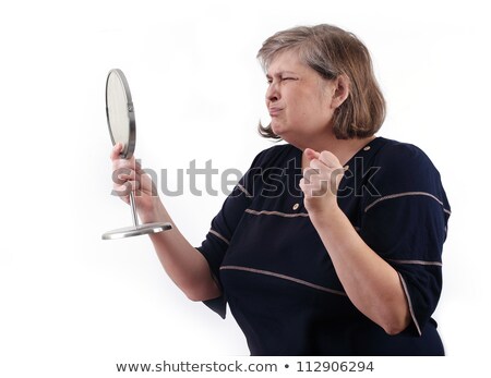 The Stout Woman Of Middle Age Cried Looking In A Mirror [[stock_photo]] © Tatik22