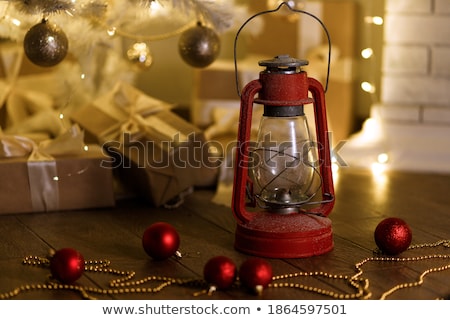 Foto d'archivio: Christmas Lanterns And Red Beads On Wood Background