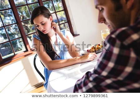 Foto stock: Upset Couple Ignoring Each Other In Restaurant