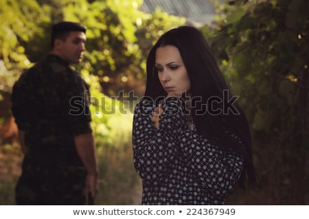 Stok fotoğraf: Sad Young Man In A Hat In The Dark