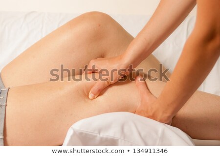 Zdjęcia stock: Therapist Giving Knee Massage To Woman