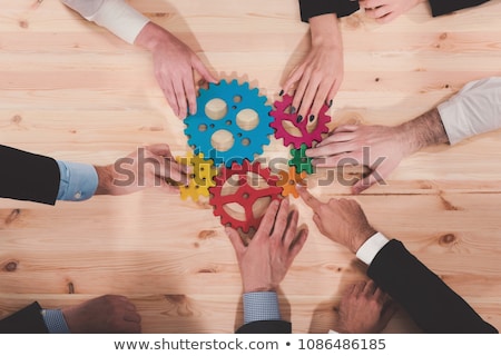 Stok fotoğraf: Business Team Connect Pieces Of Gears Teamwork Partnership And Integration Concept Double Exposur