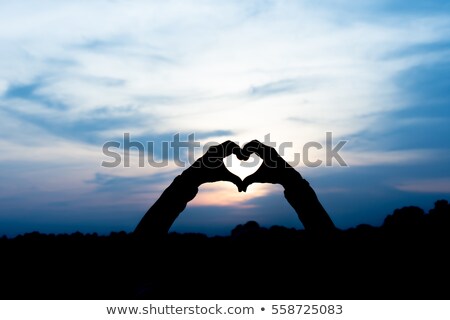 Foto stock: Silhouette Of A Heart Made By Hand