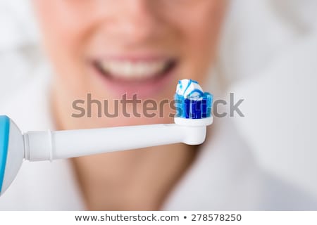 Zdjęcia stock: Close Up Of Electric Toothbrush And Paste On White