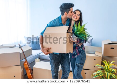 Foto stock: Couple Holding Hands Standing On Moving Day