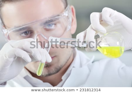 Stock photo: Young Male Chemist Working In The Lab