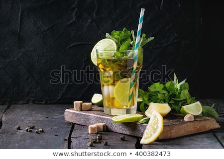 Stock photo: Black Tea With Mint And Lemon On Wooden Table