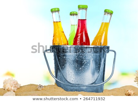 Foto stock: Assorted Soda Bottles In Ice Bucket