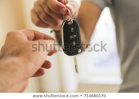 ストックフォト: Hand Giving Bunch Of Keys Over White