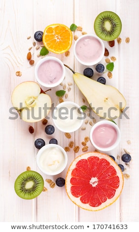 Stockfoto: Tangerine And Blueberry On White Table