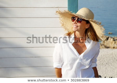 Stockfoto: Mature Woman Looking A Hat