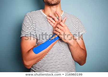 Stock fotó: Man Having Physio Therapy Tape On His Arms