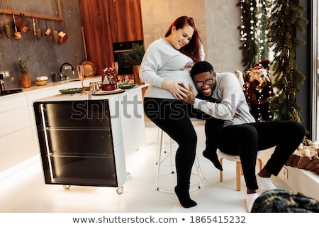 Stok fotoğraf: Pregnant Wife With Husband At Home At Christmas