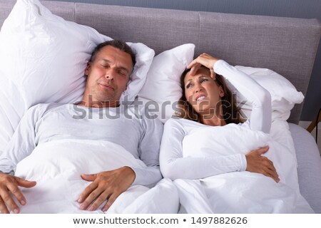 ストックフォト: Angry Woman Having Headache While Lying With Snoring Husband