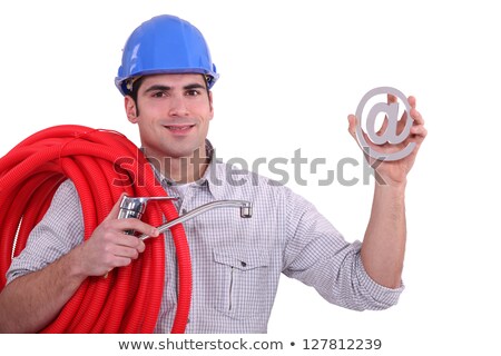 Stock fotó: Man Holding Tap Cable And At Symbol