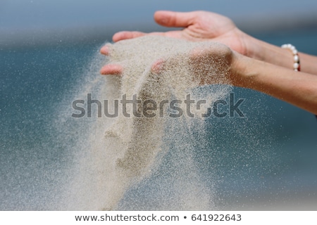 [[stock_photo]]: Hand In The Sand