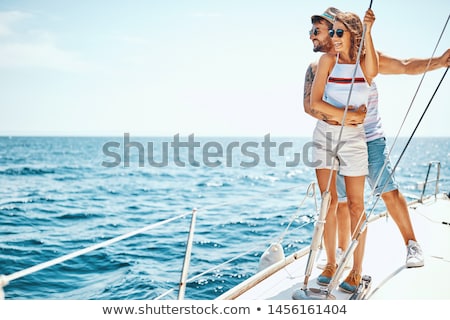 ストックフォト: Young Smiling Couple On A Sailing Boat At Summer
