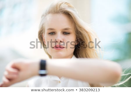 Foto stock: Close Up Portrait Of Business Woman Checking Time