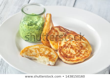 Foto stock: Portion Of Ricotta Fritters With Mint Sauce