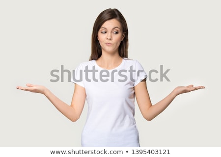Stockfoto: Reflective Or Pensive Young Female On White Shirt