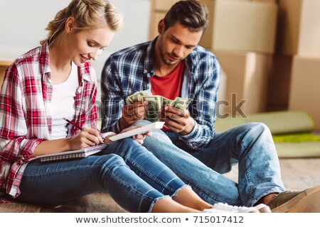 Stock photo: Young Woman Counts Money