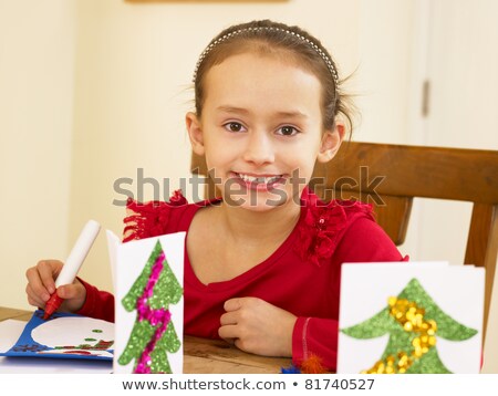 Foto stock: Young Mixed Race Child Making Christmas Cards