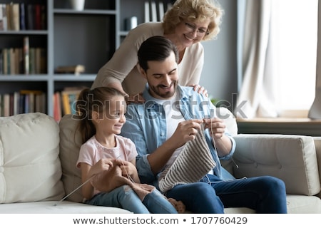 Foto stock: Senior Grandmother Sitting Enjoying Her Knitting