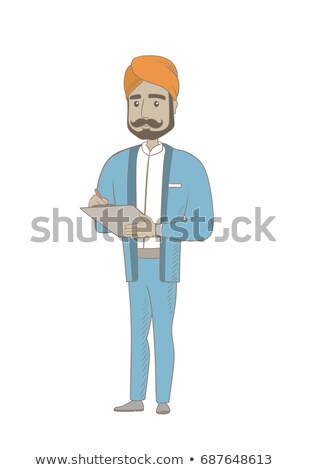 [[stock_photo]]: Hindu Businessman Writing On Clipboard