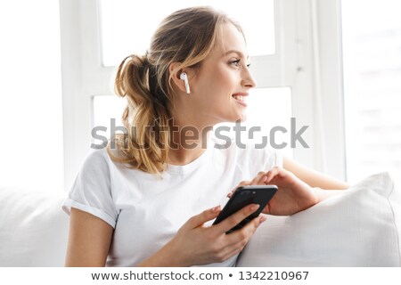 [[stock_photo]]: Portrait Of A Happy Satisfied Girl In Earphones