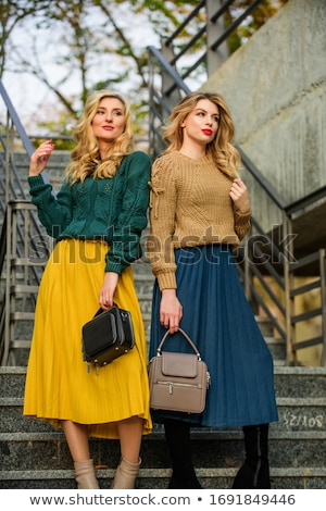 Stockfoto: Sisters In Matching Outfits Outdoors