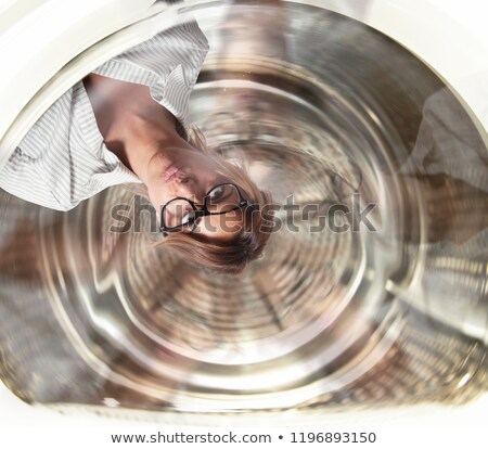 Stok fotoğraf: Confused Businesswoman Has Dizziness Inside A Washing Machine Concept Of Stress And Overwork