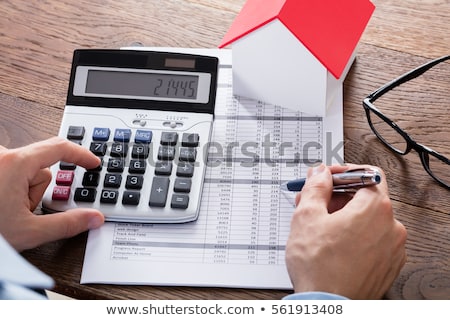 Stock photo: Businessperson Calculating Property Tax