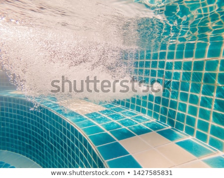 Foto stock: Under Water Pool Working Drain Close Up
