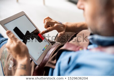 Stock photo: Touchpad In Hands Of Professional Creative Painter Pointing At Touchscreen