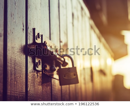 Foto stock: Latch With Padlock On Door