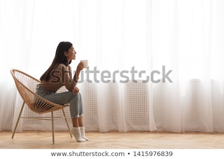 Foto stock: Asian Woman At Windows