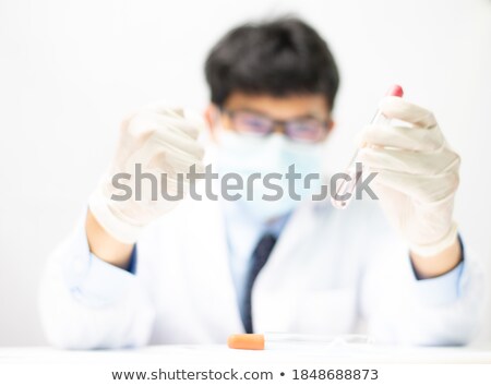 Сток-фото: A Scientist Doing Experiments In His Laboratory