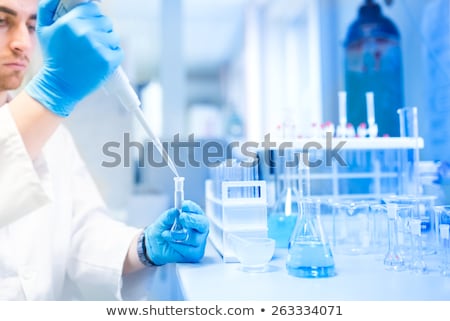 [[stock_photo]]: A Scientist Using Test Tubes