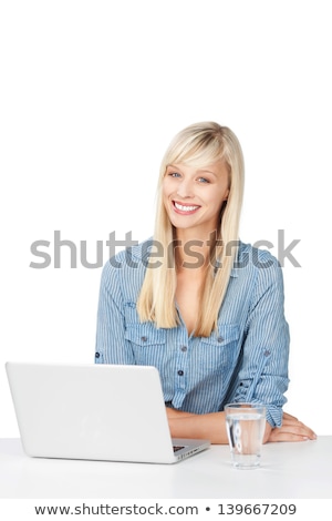 Stock foto: Woman Sat At Desk Drinking Glass Of Water