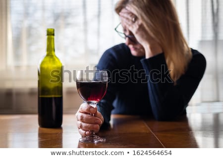 Stok fotoğraf: Drunk Woman With Wine And Glass In Hand