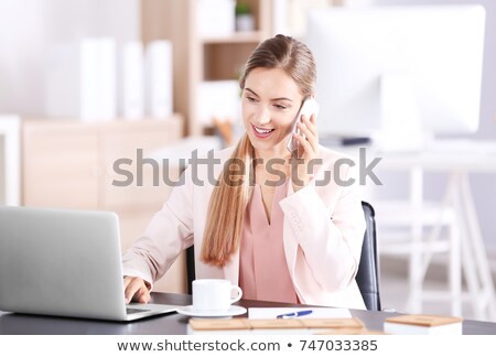 Stockfoto: Elegant Young Businesswoman Talking By Phone