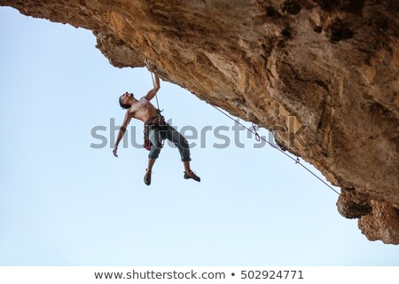 Stock fotó: Shirtless Man Hanging At The Rope