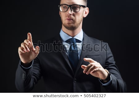 Foto d'archivio: Businessman In Suit Touching Something Invisible