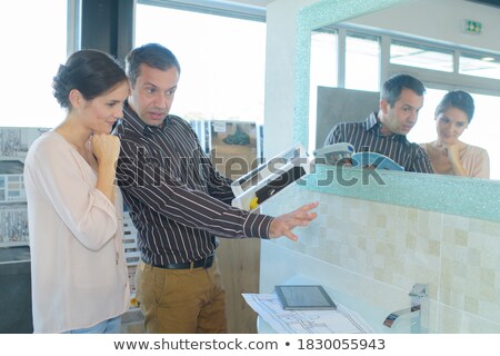 Foto d'archivio: Senior Man Choosing A Bathroomkitchen Tap