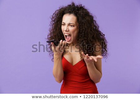 Zdjęcia stock: Image Of Angry Woman 20s Wearing Red Dress Screaming While Talki